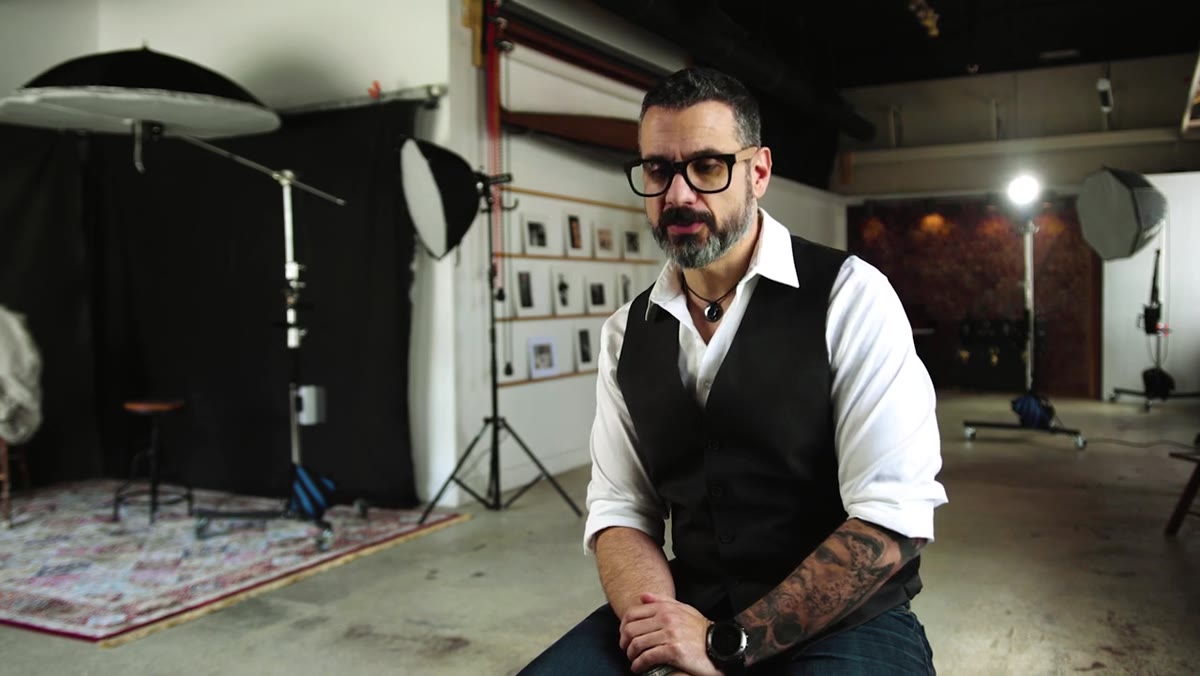 Matt describing early photography work at the shooting range