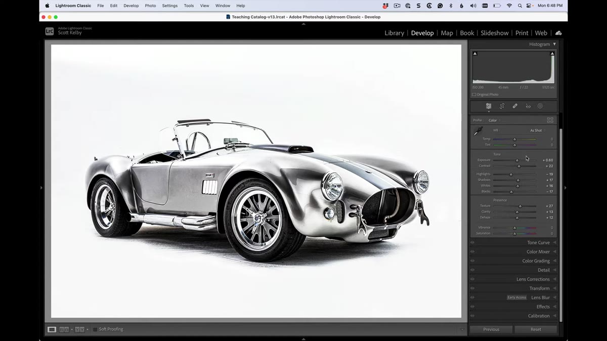 Lightroom Develop panel showing multiple adjusted sliders on a car image